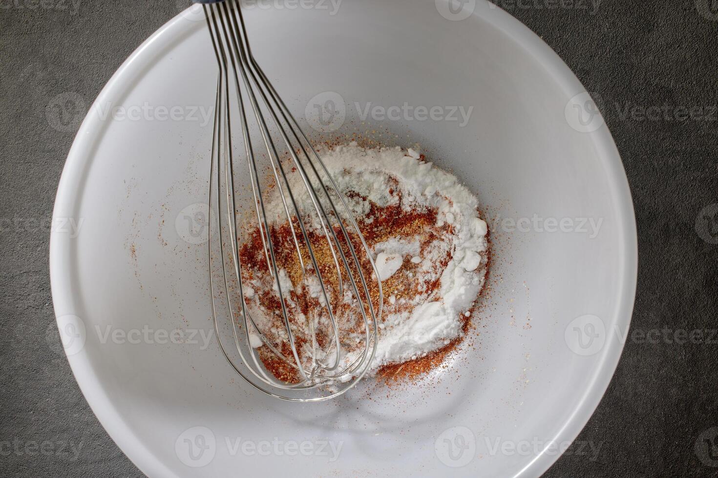 spices with salt and baking powder are mixed in a white bowl photo