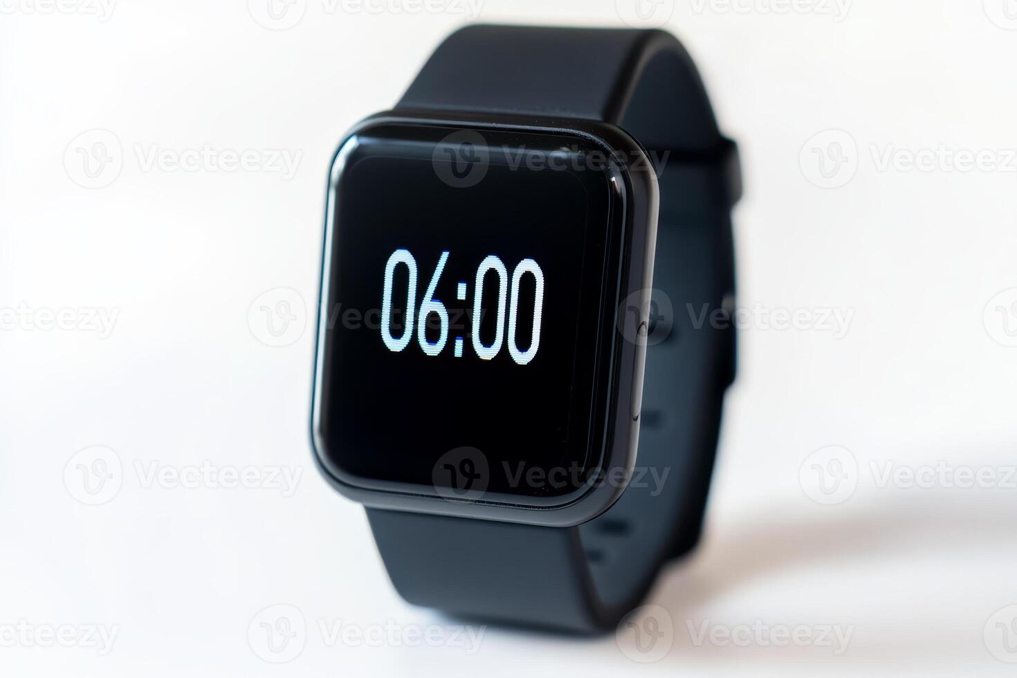 Close up of modern black smartwatch displaying the time 06 00 on its sleek digital screen. The minimalist design emphasizes technology and contemporary style. Modern lifestyle themes photo