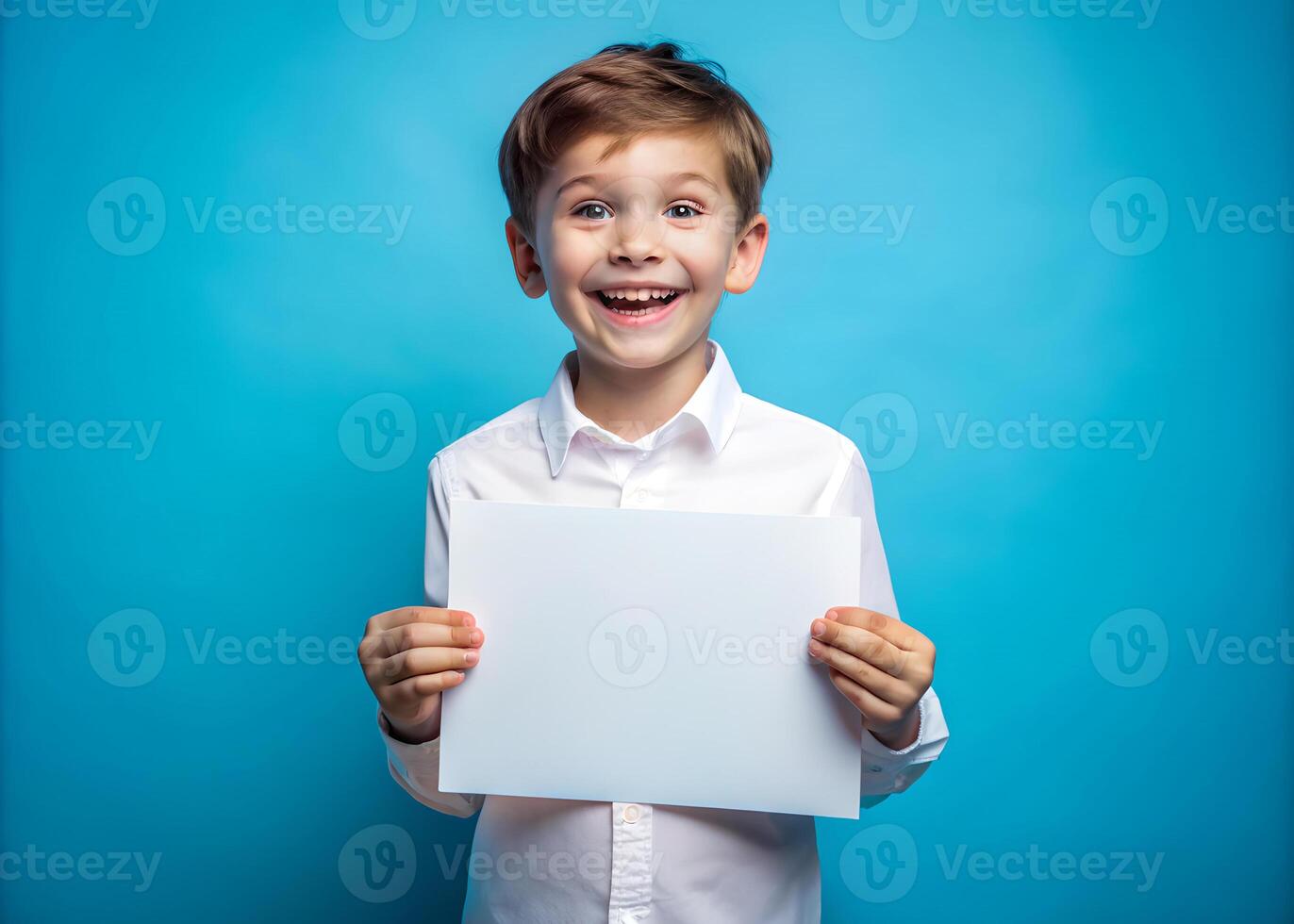 Mock up of a handsome boy wearing a white shirt on blue background. Little child holding a blank board. photo