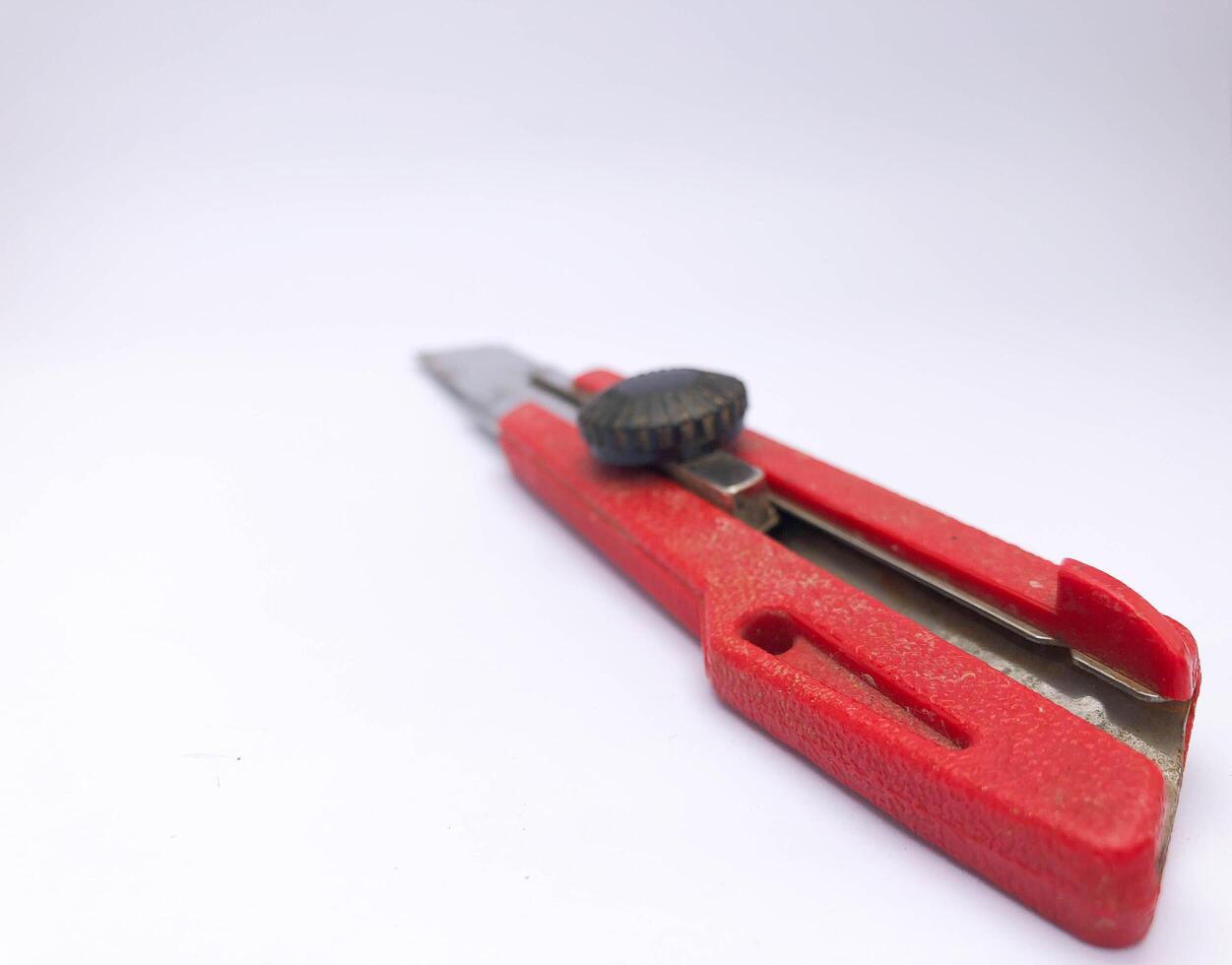 red cutter knife isolated on a white background, good for background, decoration, etc. photo