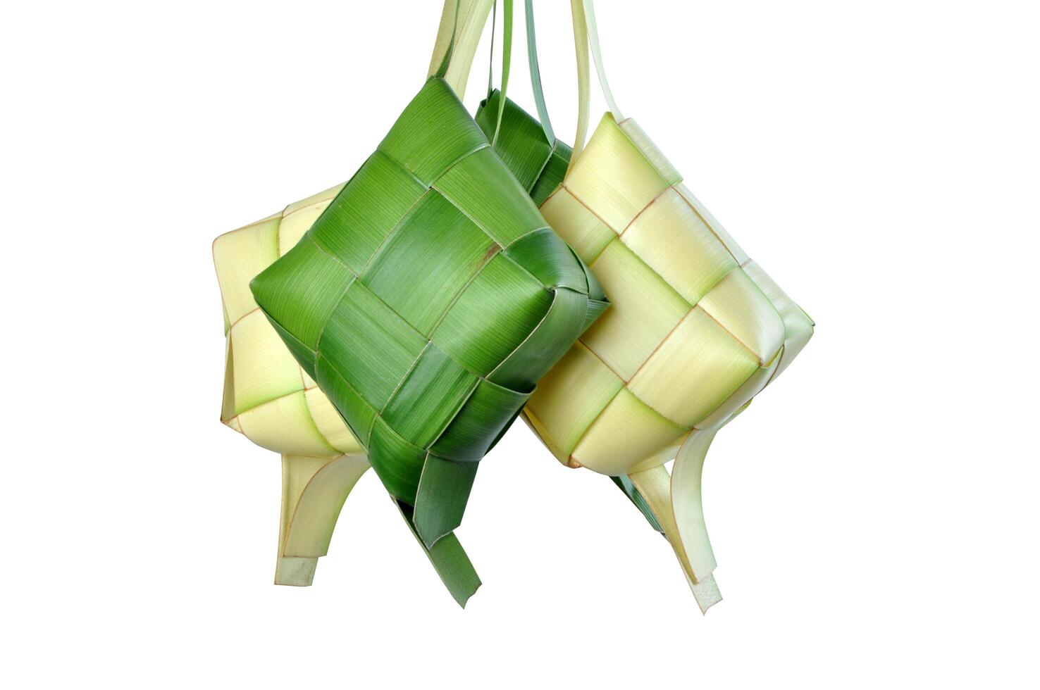 Ketupat is a traditional Indonesian food with rice wrapped in coconut leaves photo