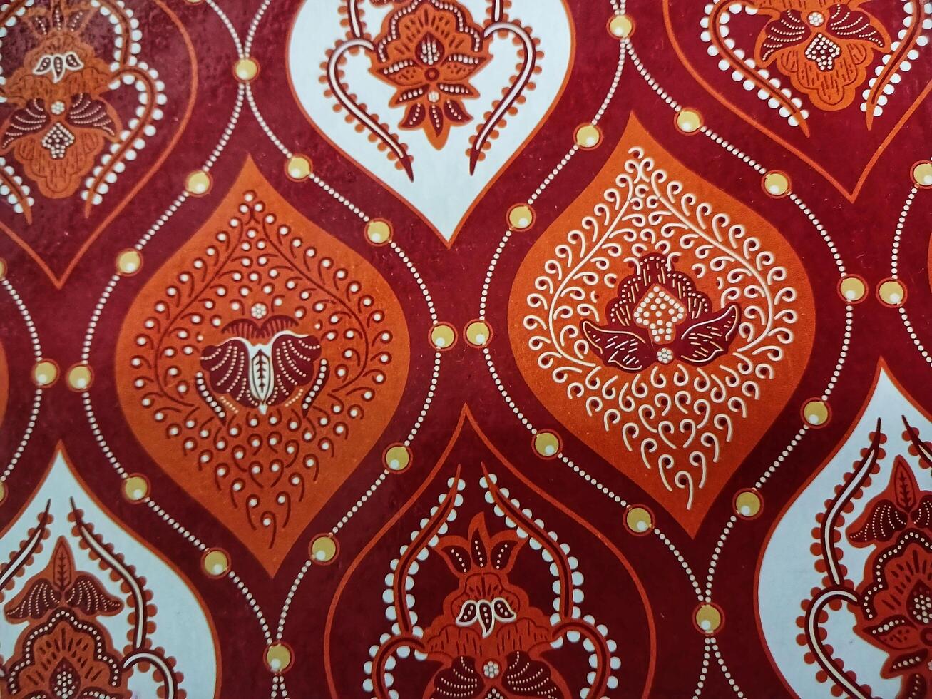 Traditional Indonesian batik cloth pattern is dominated by brown color photo