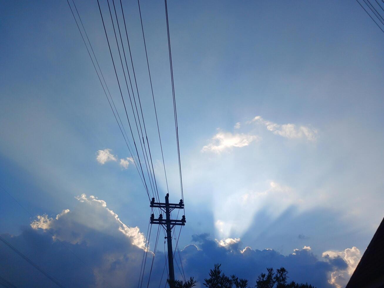 Beautiful blue cloud landscape with industrial electric forks. photo