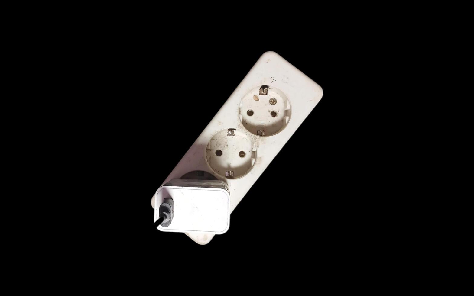 White electrical plug in wall socket. photo