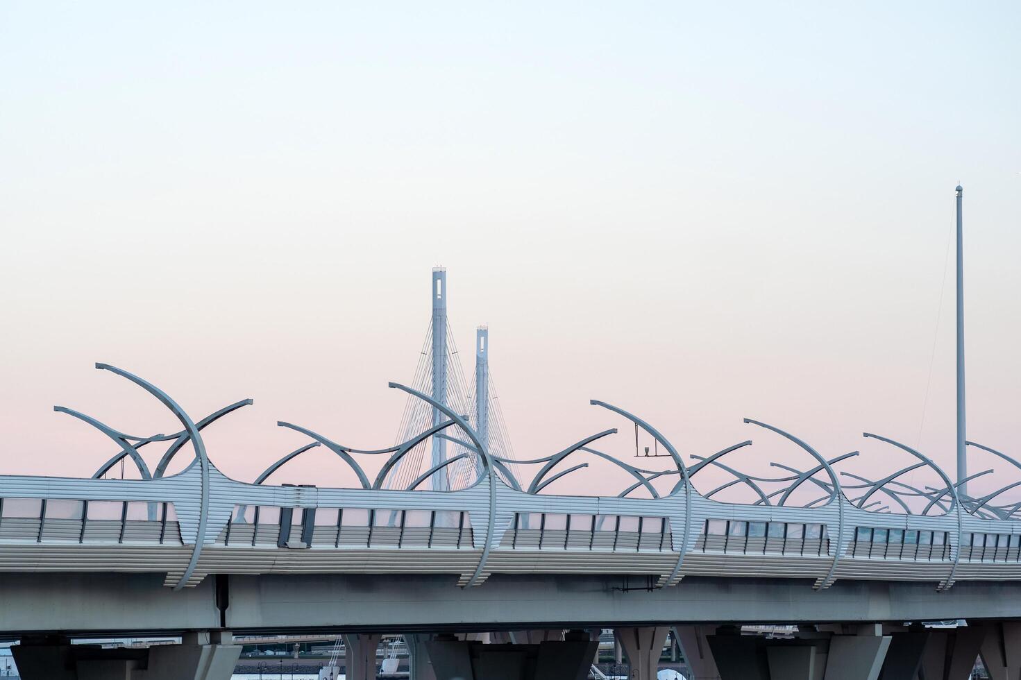 urban background with a fragment of a high-speed automobile overpass on the background of a bridge photo