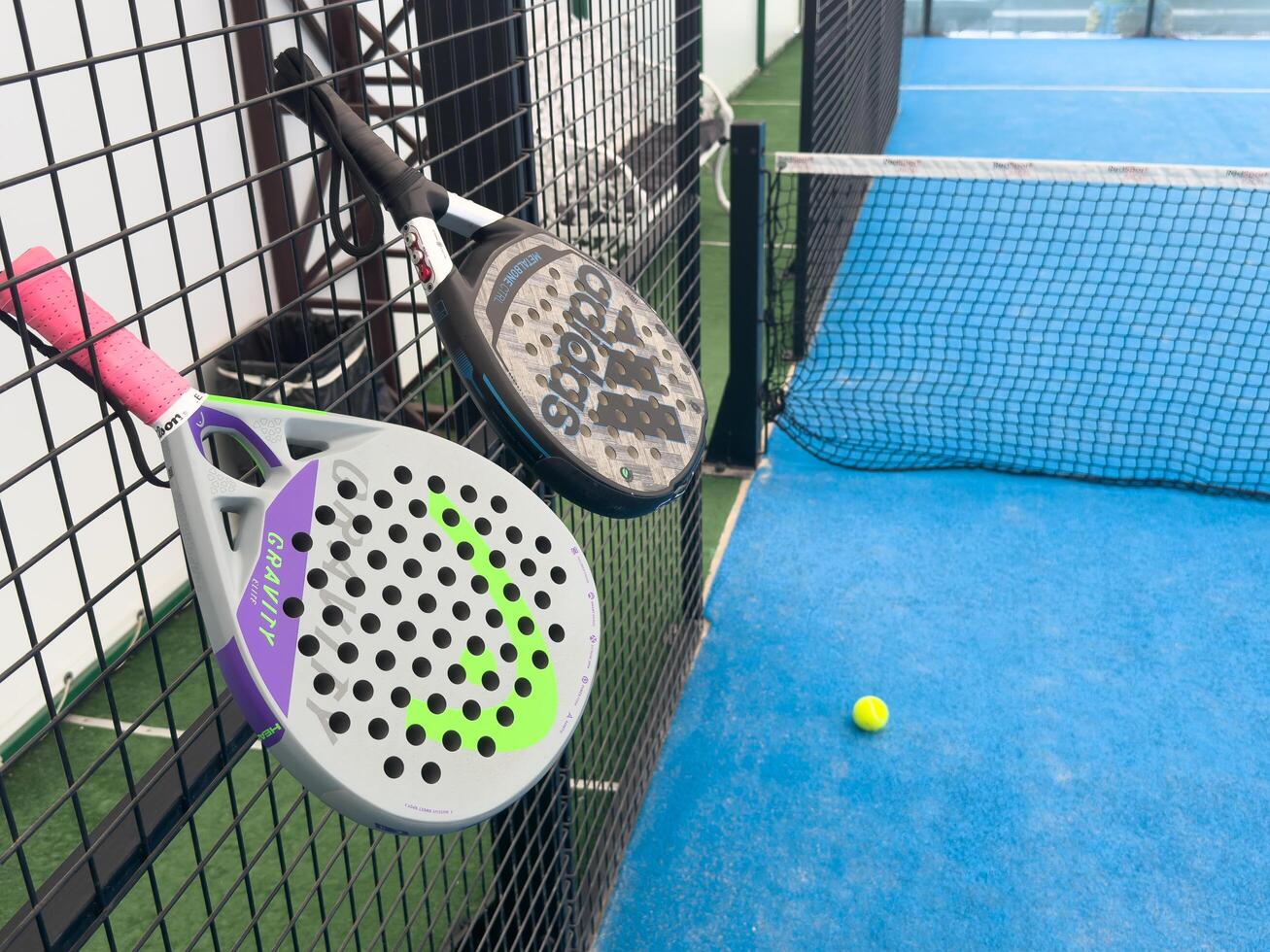 Kyiv, Ukraine, July 10, 2024 paddle tennis racket and balls, adidas, head photo