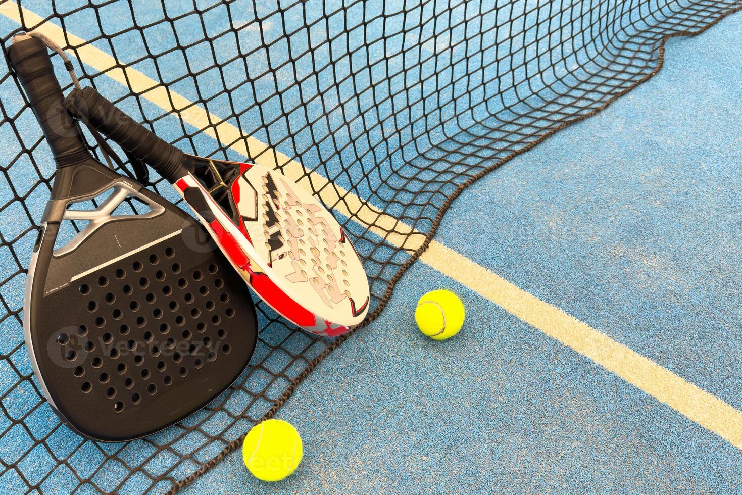 professional paddle tennis racket with natural lighting on court background. Horizontal sport theme poster, greeting cards, headers, website and app photo