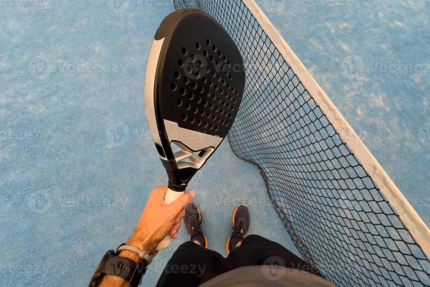 paddle tennis player, hands and racket ready for serve photo