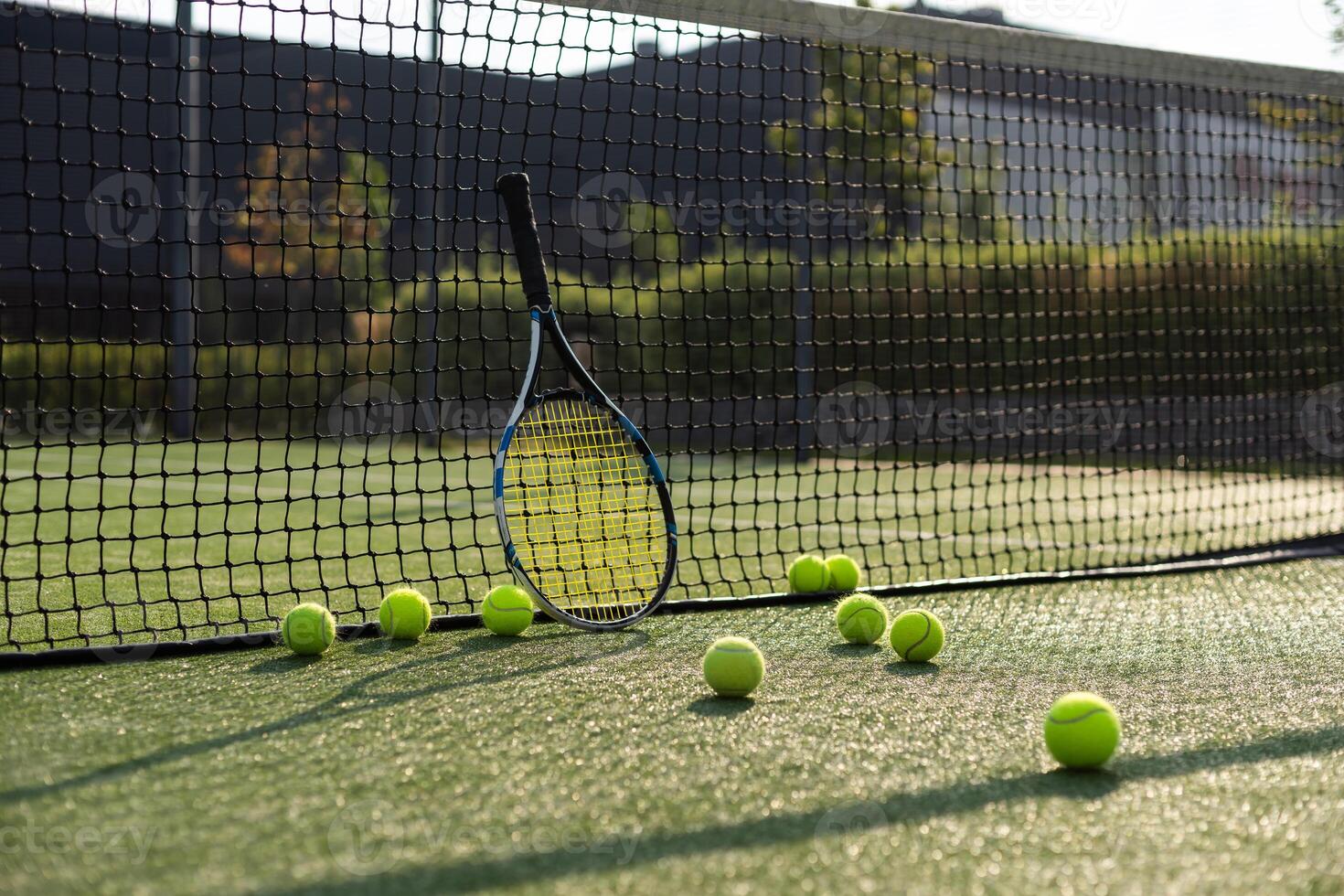 Leeds UK May 24 2016 Tennis ball and racket on a hard court with coloured filter applied during processing-illustrative editorial photo