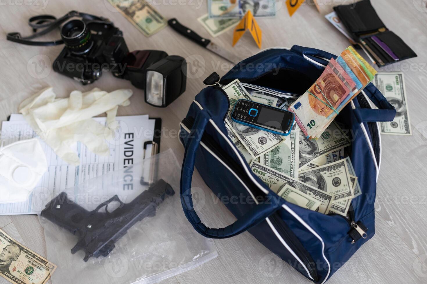 Handcuffs on many stacks of dollar bills. Metal suitcase with money, concept of arrest, investigation and fraud. photo
