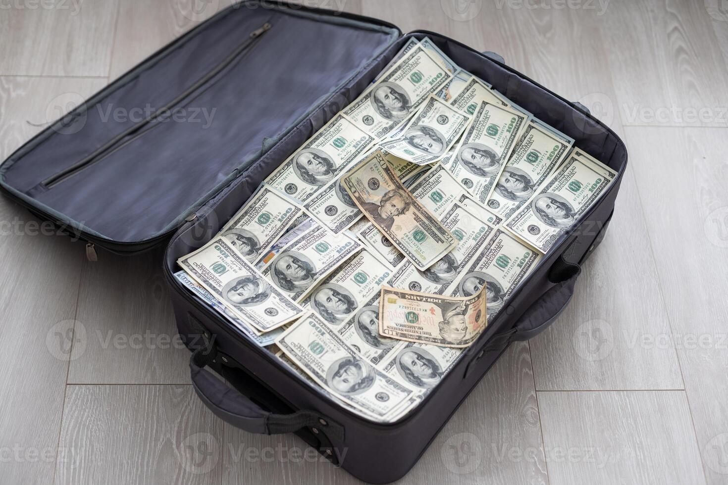 Open suitcase with one million dollars bills stacks photo