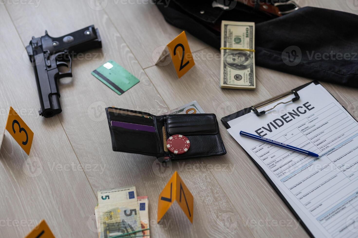 High contrast image of a crime scene with gun and markers on the floor photo