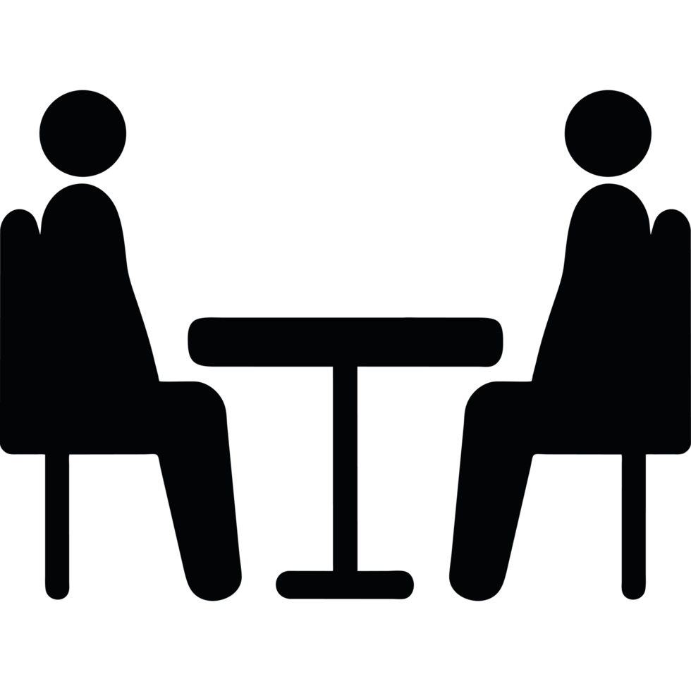 Two people sitting at a table in a dark room png