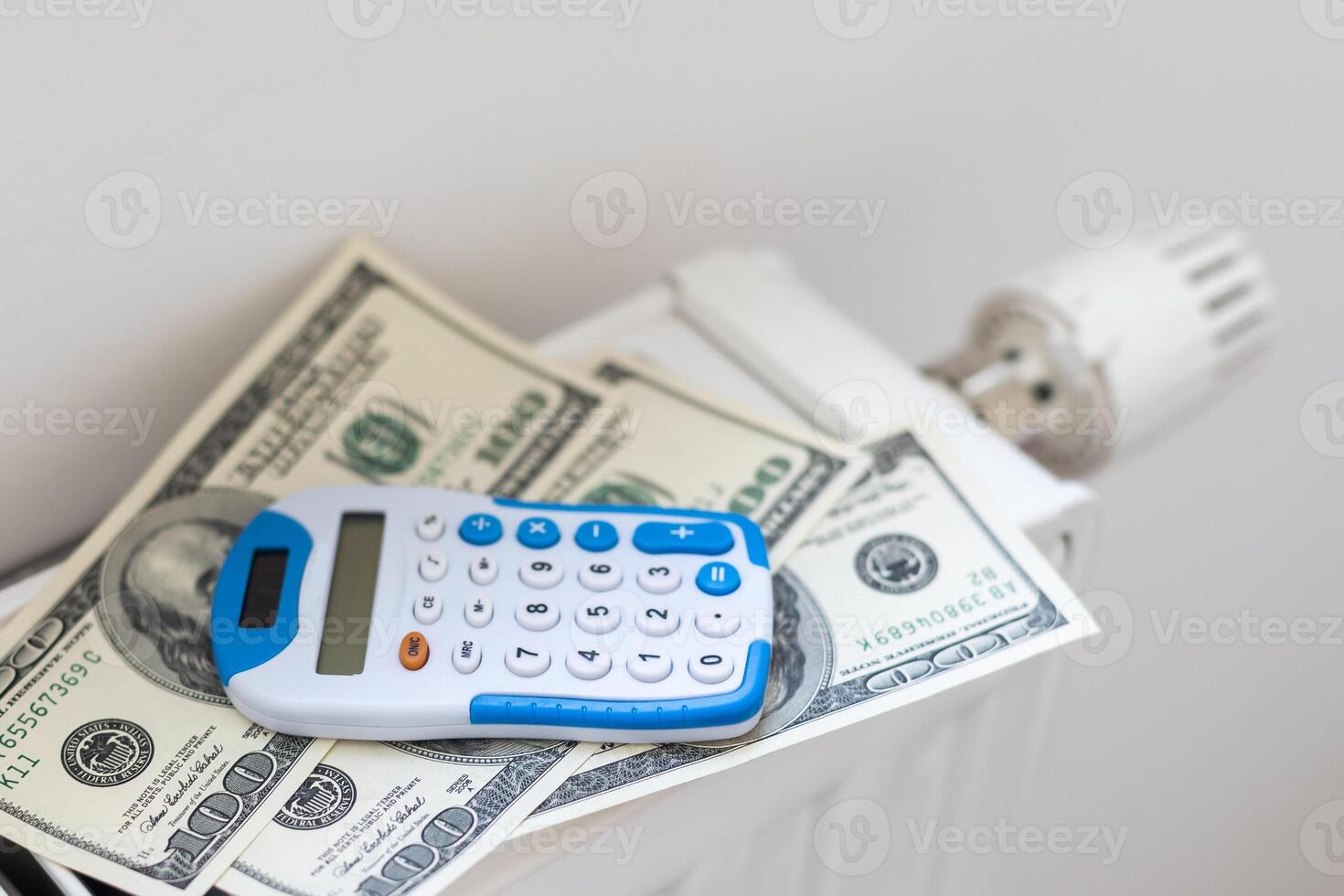 Energy crisis in Europe concept. Heating radiator, calculator and euro banknotes photo