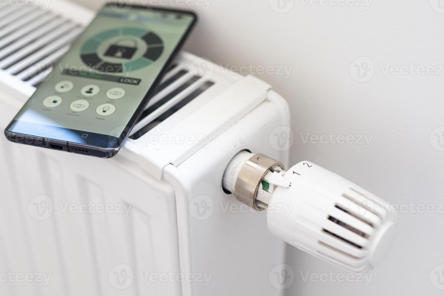 House heating with central heating. Temperature control on the radiator in the apartment on smartphone during the heating season. Thermostat. Smart home. Heating season photo