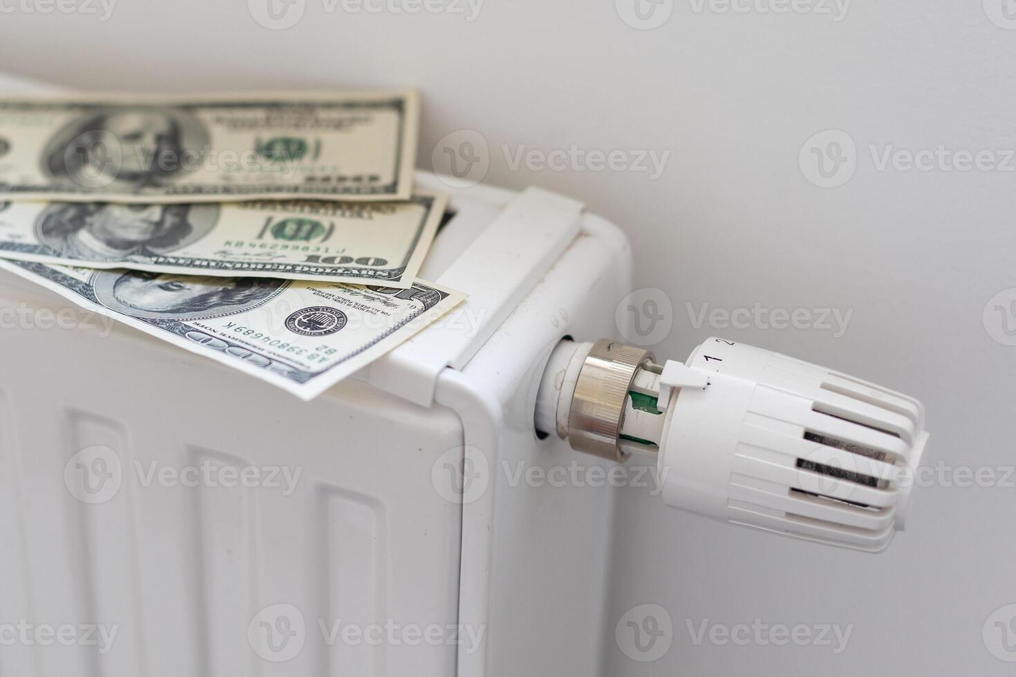 gas bill in front of heating radiator. Payment for heating in winter. photo