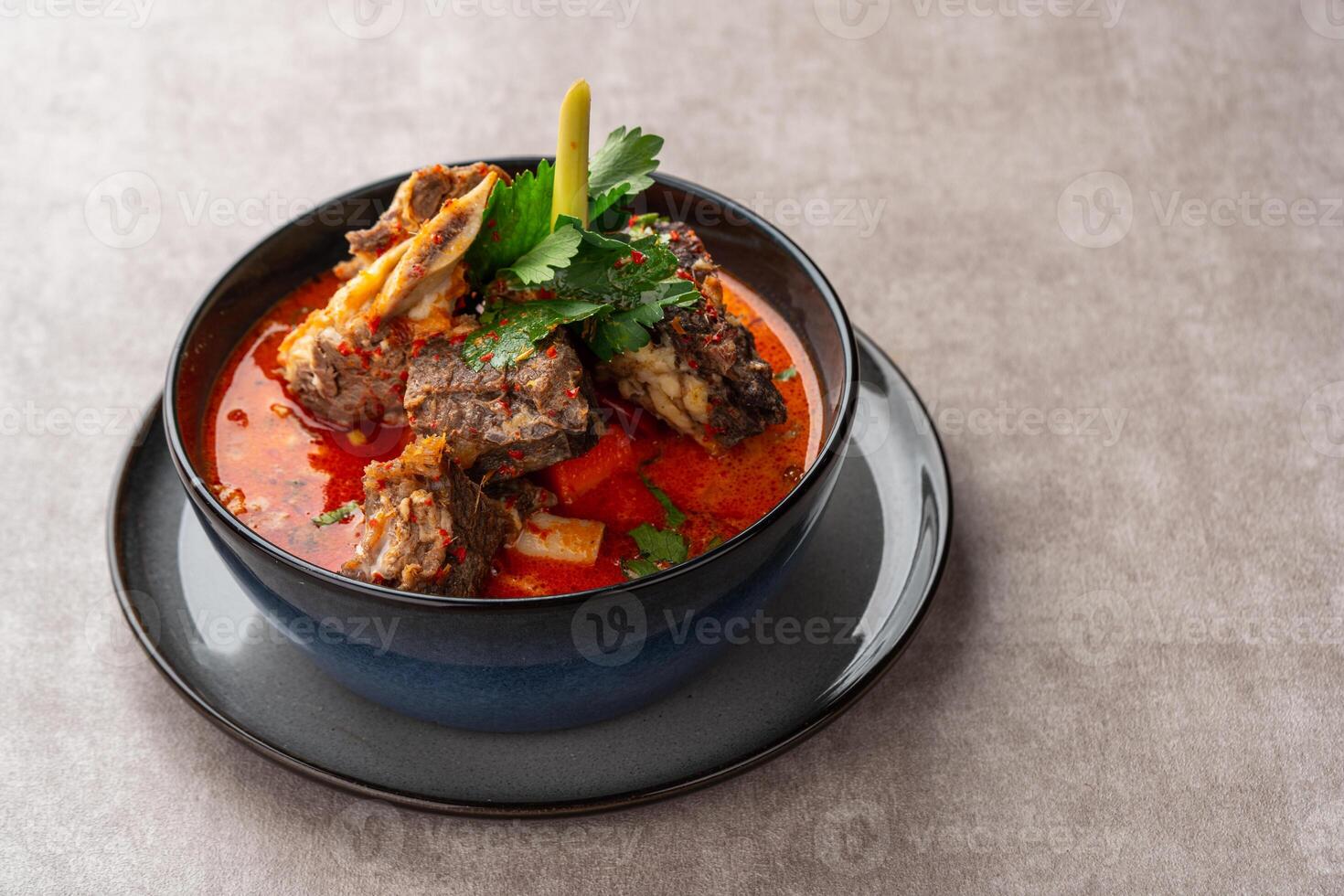 Soto Tangkar is Betawi food. The name Tangkar itself is a term for beef ribs in Betawi language. Soto Tangkar cooked in thin coconut milk soup spiced with red curry. photo