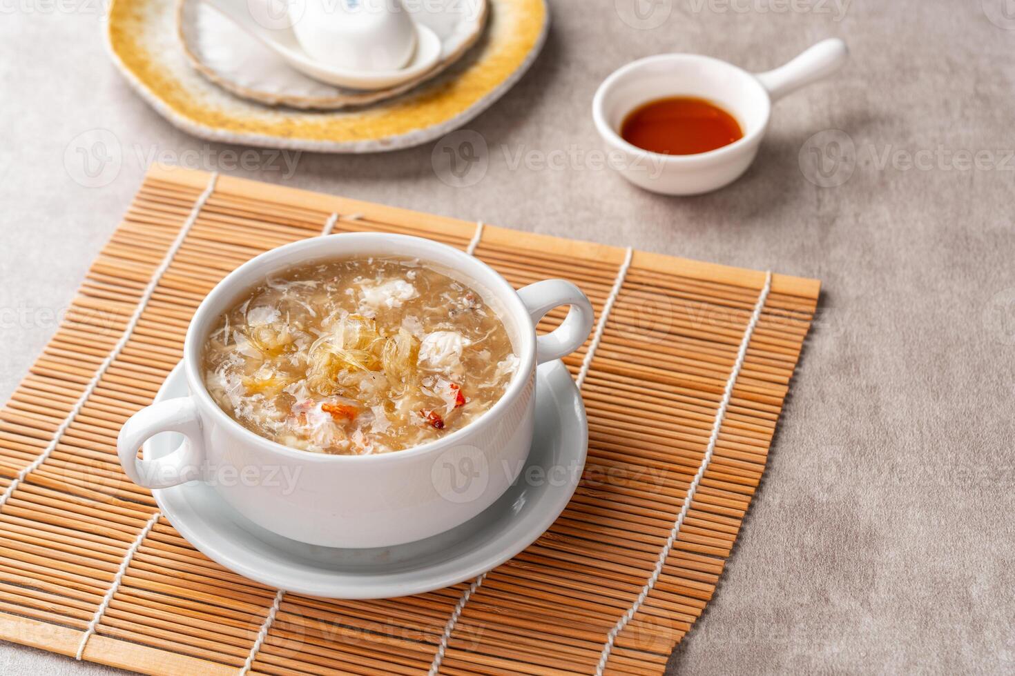 Shark fin soup or Soup Sirip Ikan Hiu is a popular soup in Chinese cuisine which is usually served on special occasions such as weddings or banquets. photo