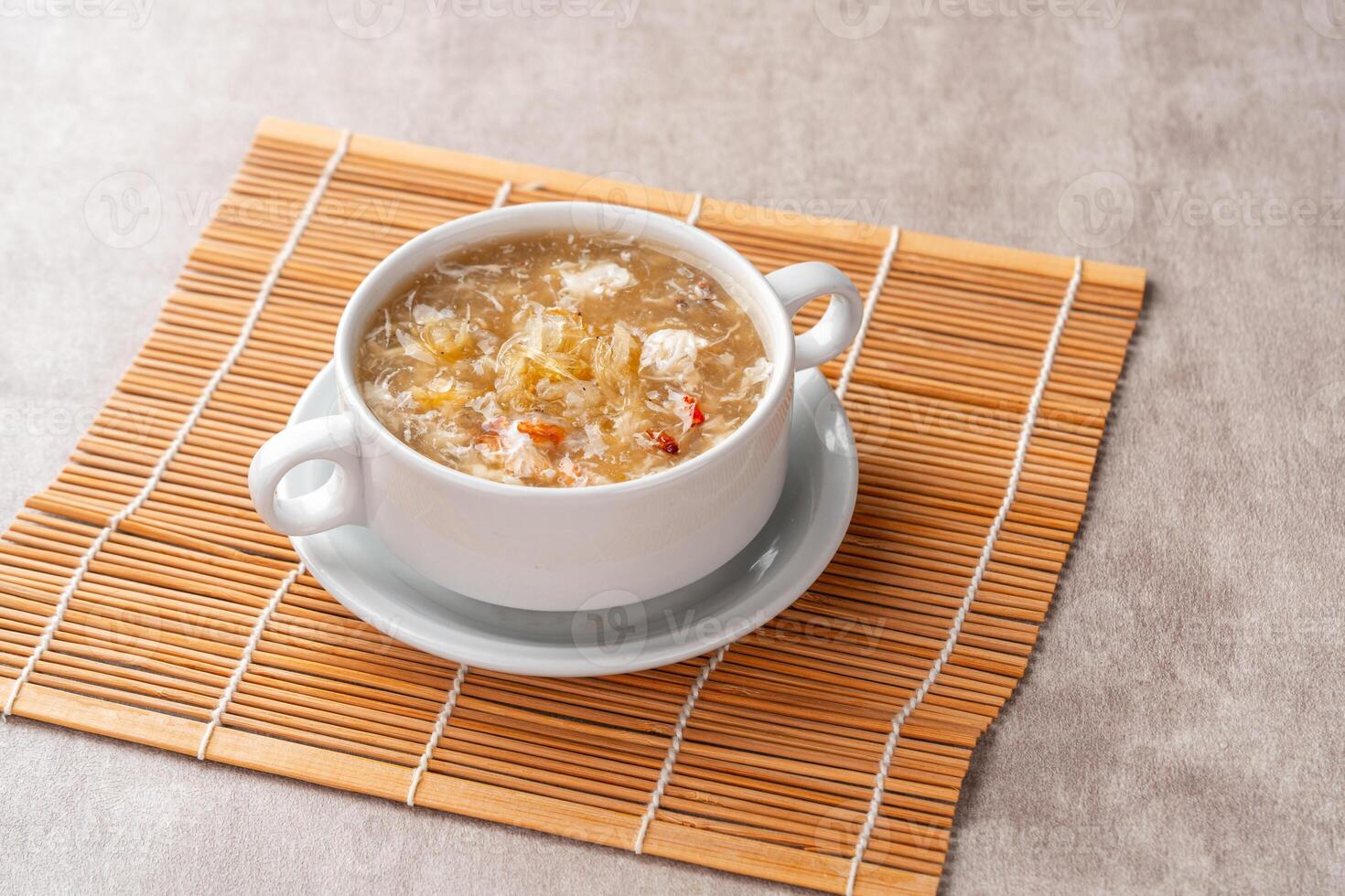 Shark fin soup or Soup Sirip Ikan Hiu is a popular soup in Chinese cuisine which is usually served on special occasions such as weddings or banquets. photo
