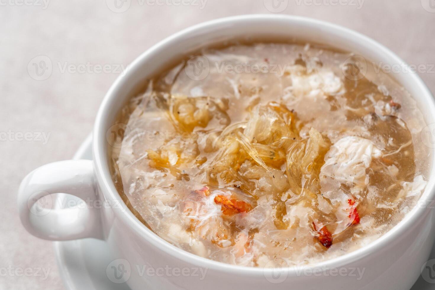 Shark fin soup or Soup Sirip Ikan Hiu is a popular soup in Chinese cuisine which is usually served on special occasions such as weddings or banquets. photo