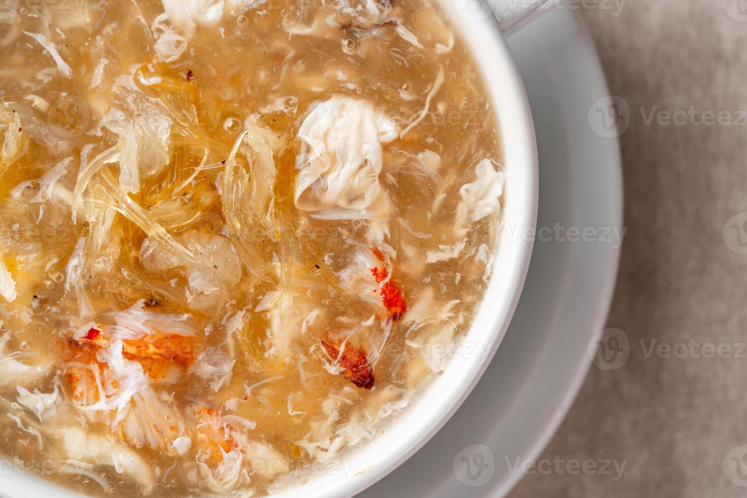 Shark fin soup or Soup Sirip Ikan Hiu is a popular soup in Chinese cuisine which is usually served on special occasions such as weddings or banquets. photo