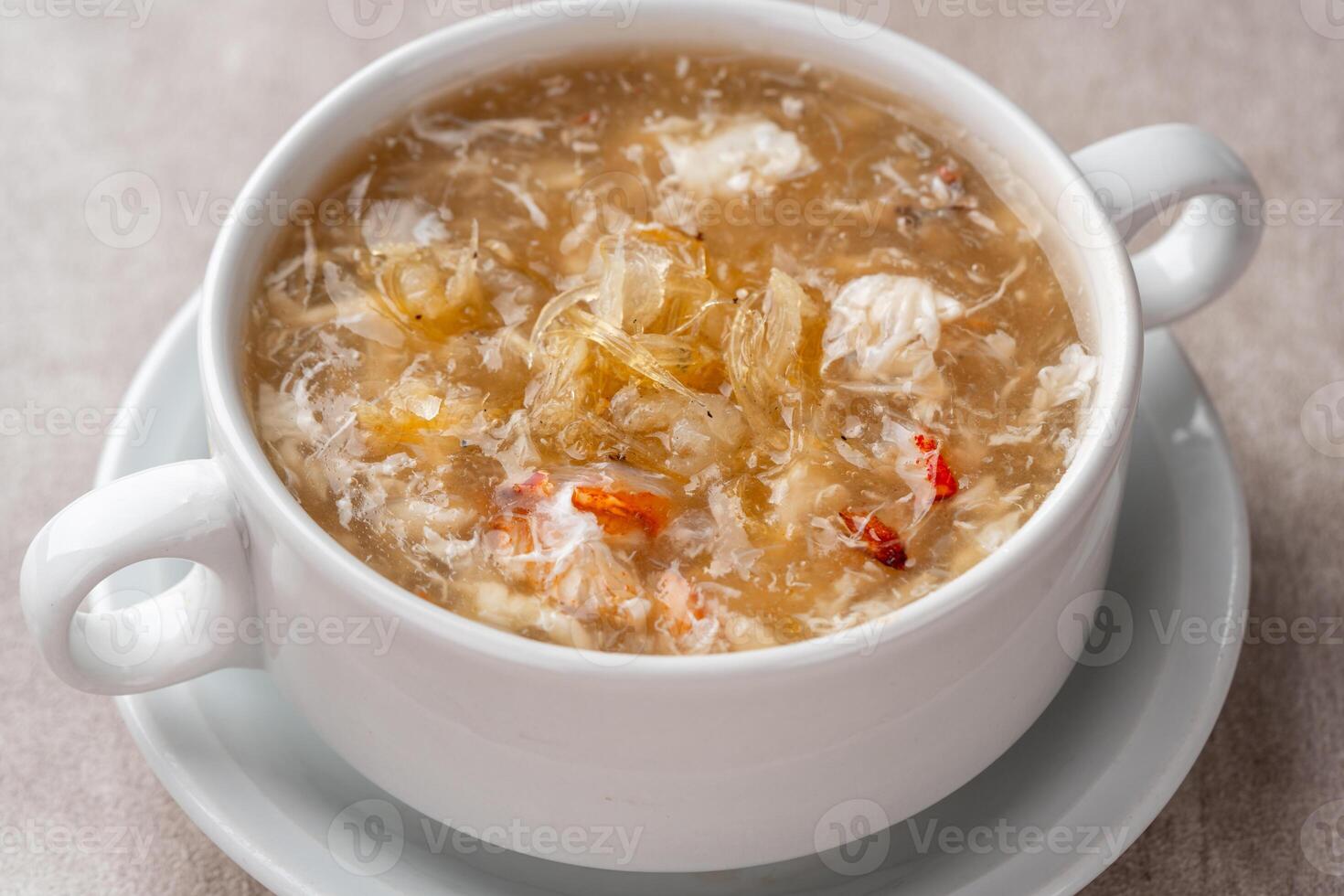 Shark fin soup or Soup Sirip Ikan Hiu is a popular soup in Chinese cuisine which is usually served on special occasions such as weddings or banquets. photo