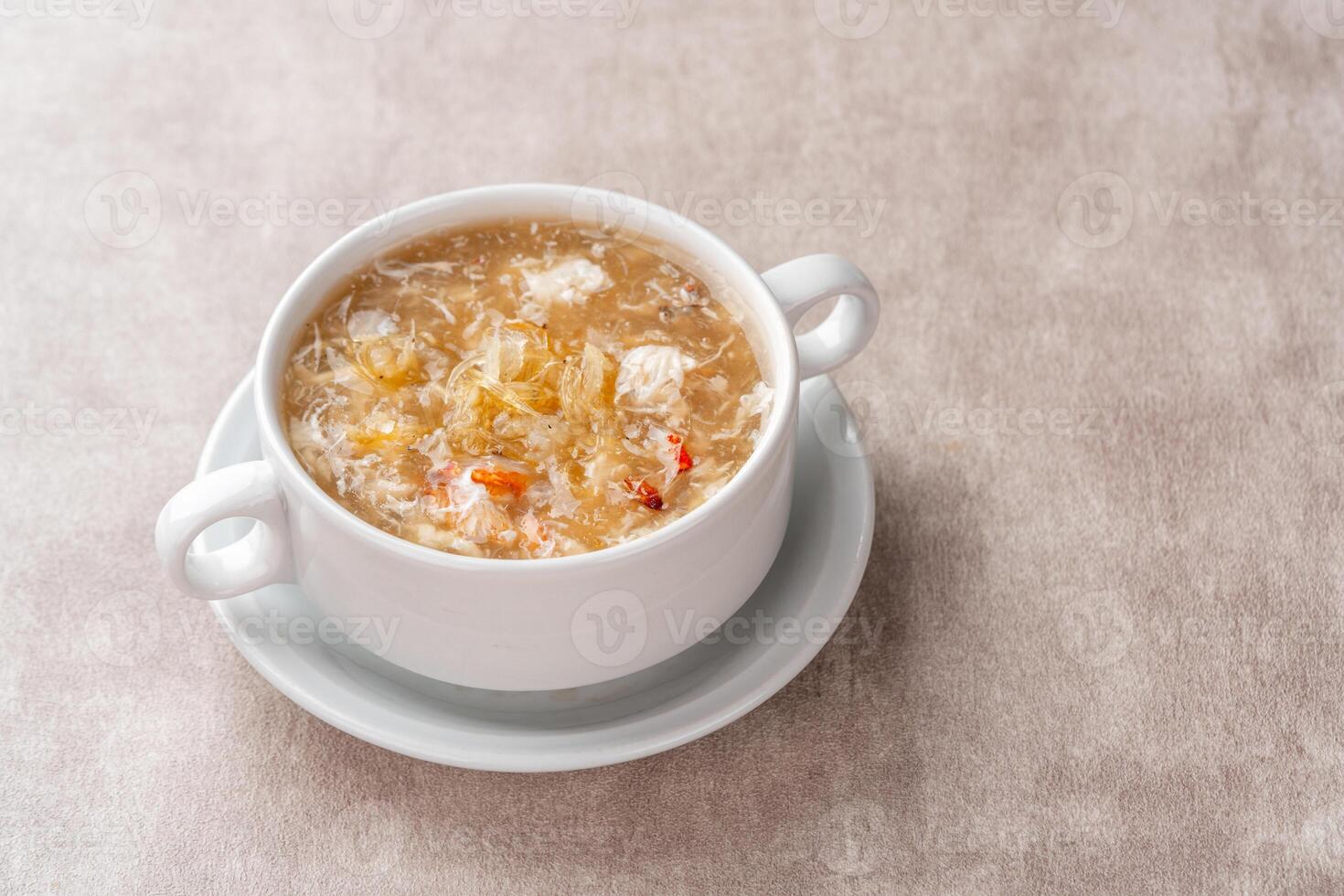 Shark fin soup or Soup Sirip Ikan Hiu is a popular soup in Chinese cuisine which is usually served on special occasions such as weddings or banquets. photo
