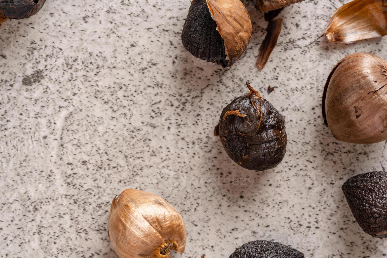 Fermented black garlic. The color is a result of the Maillard reaction or caramelization. Black garlic can help to regulate blood sugar levels photo