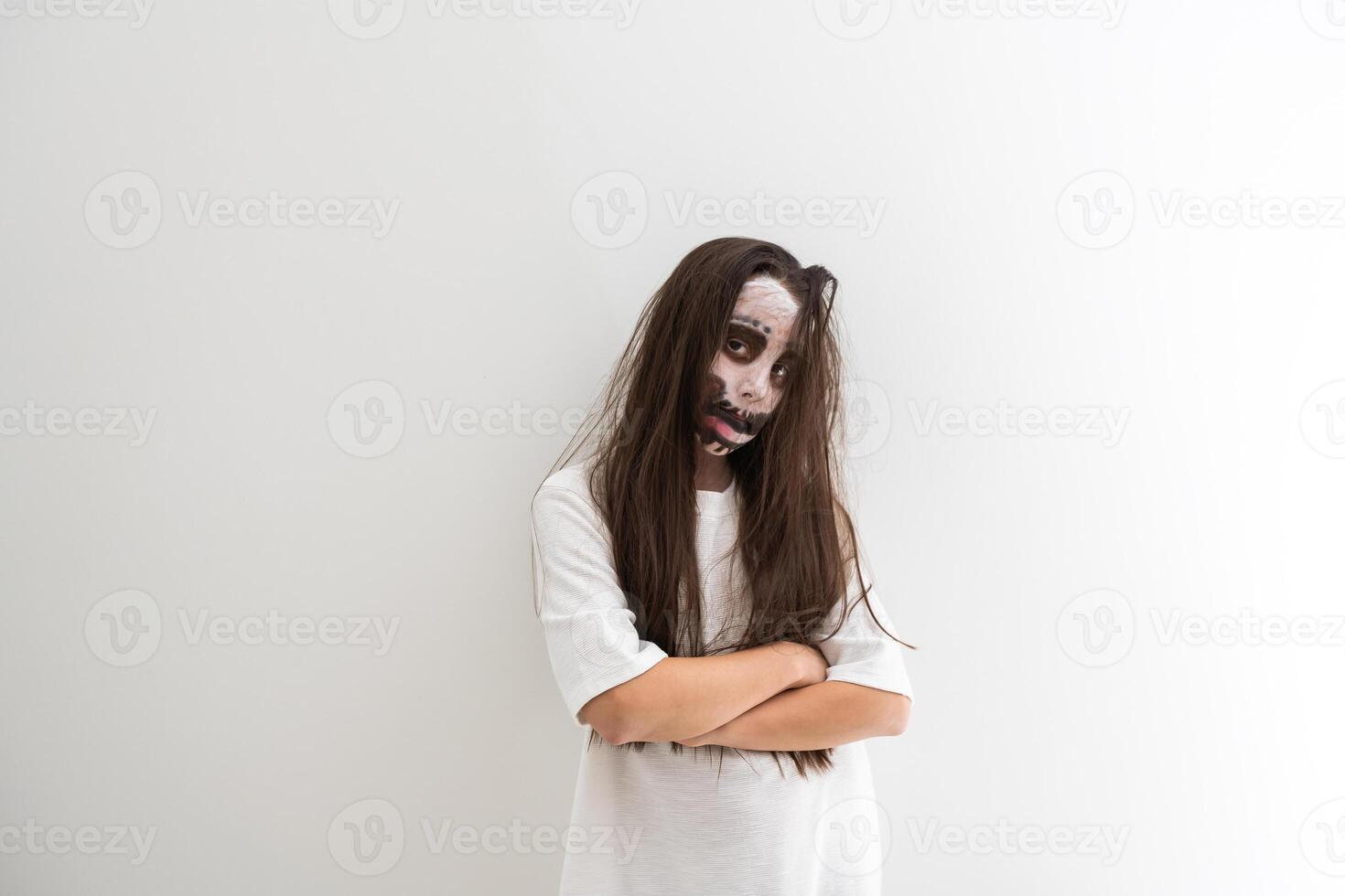 scary girl in white dress from horror film in room photo