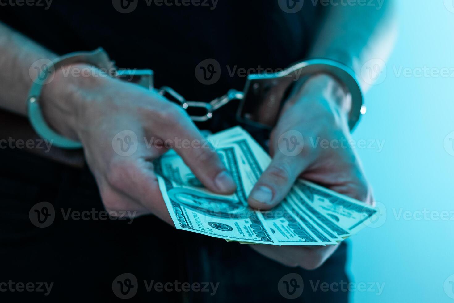 Arrested man handcuffed hands at the back. prisoner concept, Handcuffed hands of a prisoner in prison, Male prisoners were severely strained in the dark prison, violence, handcuffed hands is strapped photo