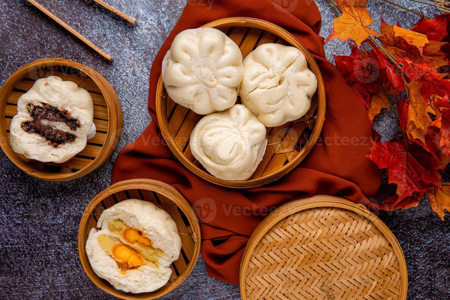 Baozi or Bakpao is a type of yeast-leavened filled bun in various Chinese cuisines. photo