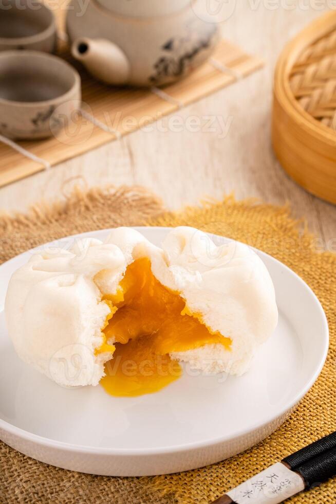 Baozi or Bakpao is a type of yeast-leavened filled bun in various Chinese cuisines. photo