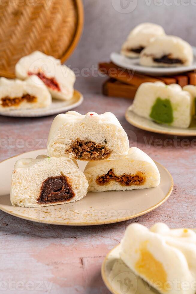 Baozi or Bakpao is a type of yeast-leavened filled bun in various Chinese cuisines. photo