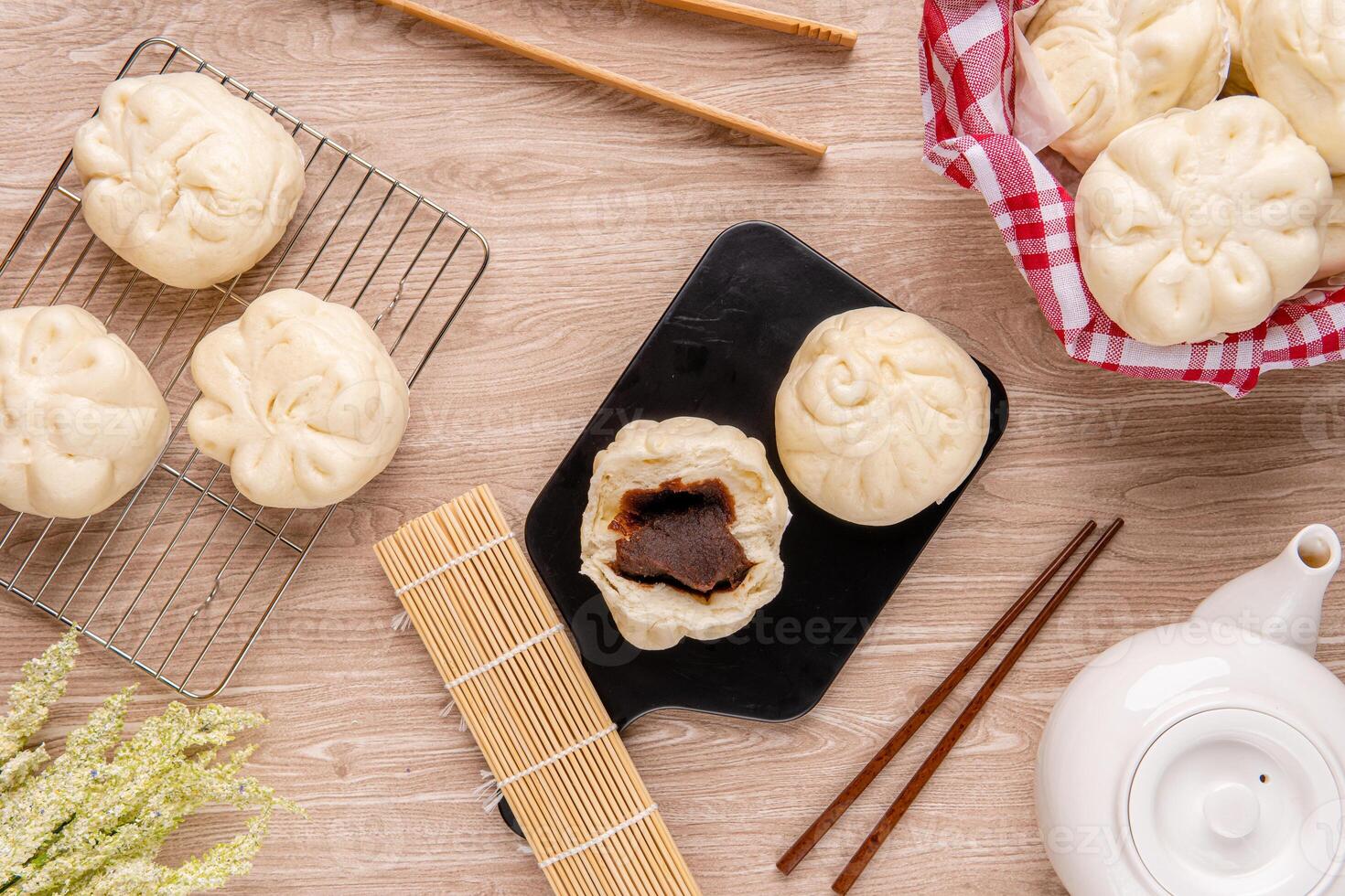 Baozi or Bakpao is a type of yeast-leavened filled bun in various Chinese cuisines. photo