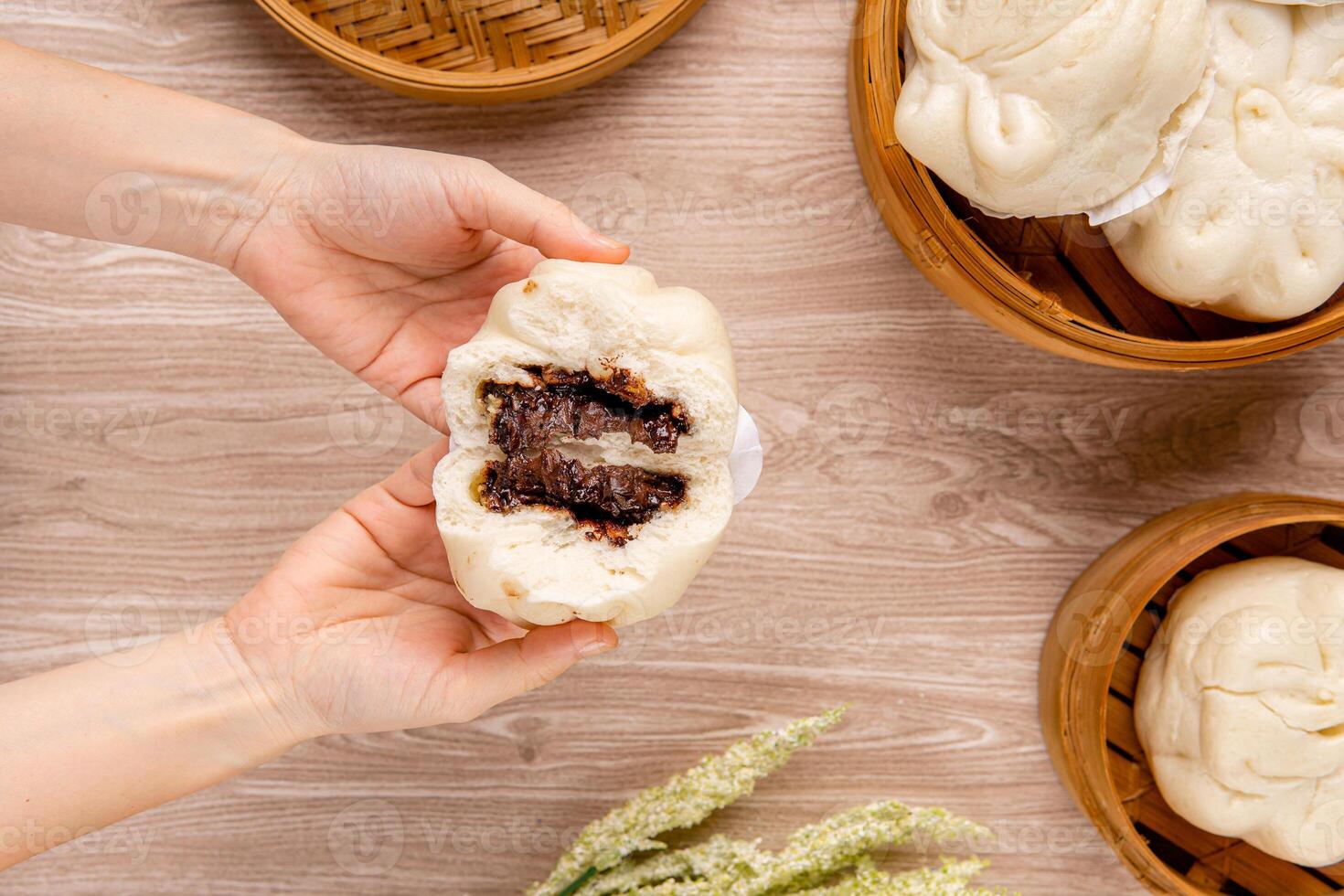 Baozi or Bakpao is a type of yeast-leavened filled bun in various Chinese cuisines. photo