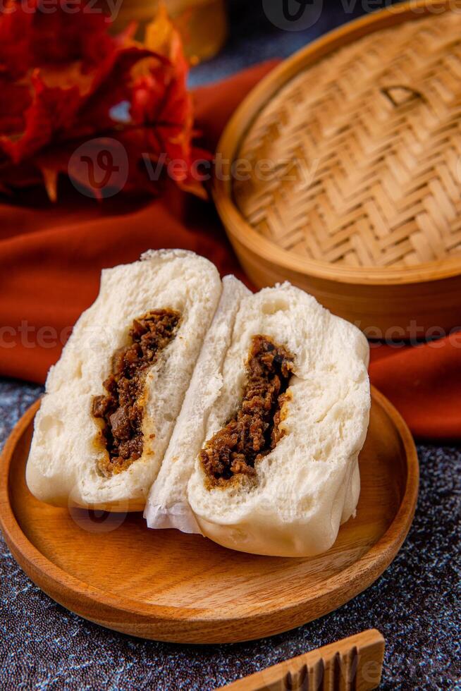 Baozi or Bakpao is a type of yeast-leavened filled bun in various Chinese cuisines. photo