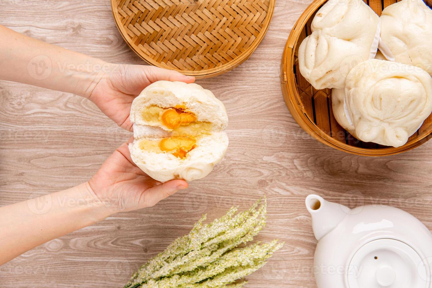 Baozi or Bakpao is a type of yeast-leavened filled bun in various Chinese cuisines. photo