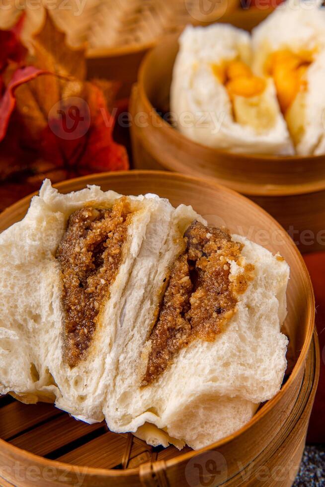 Baozi or Bakpao is a type of yeast-leavened filled bun in various Chinese cuisines. photo