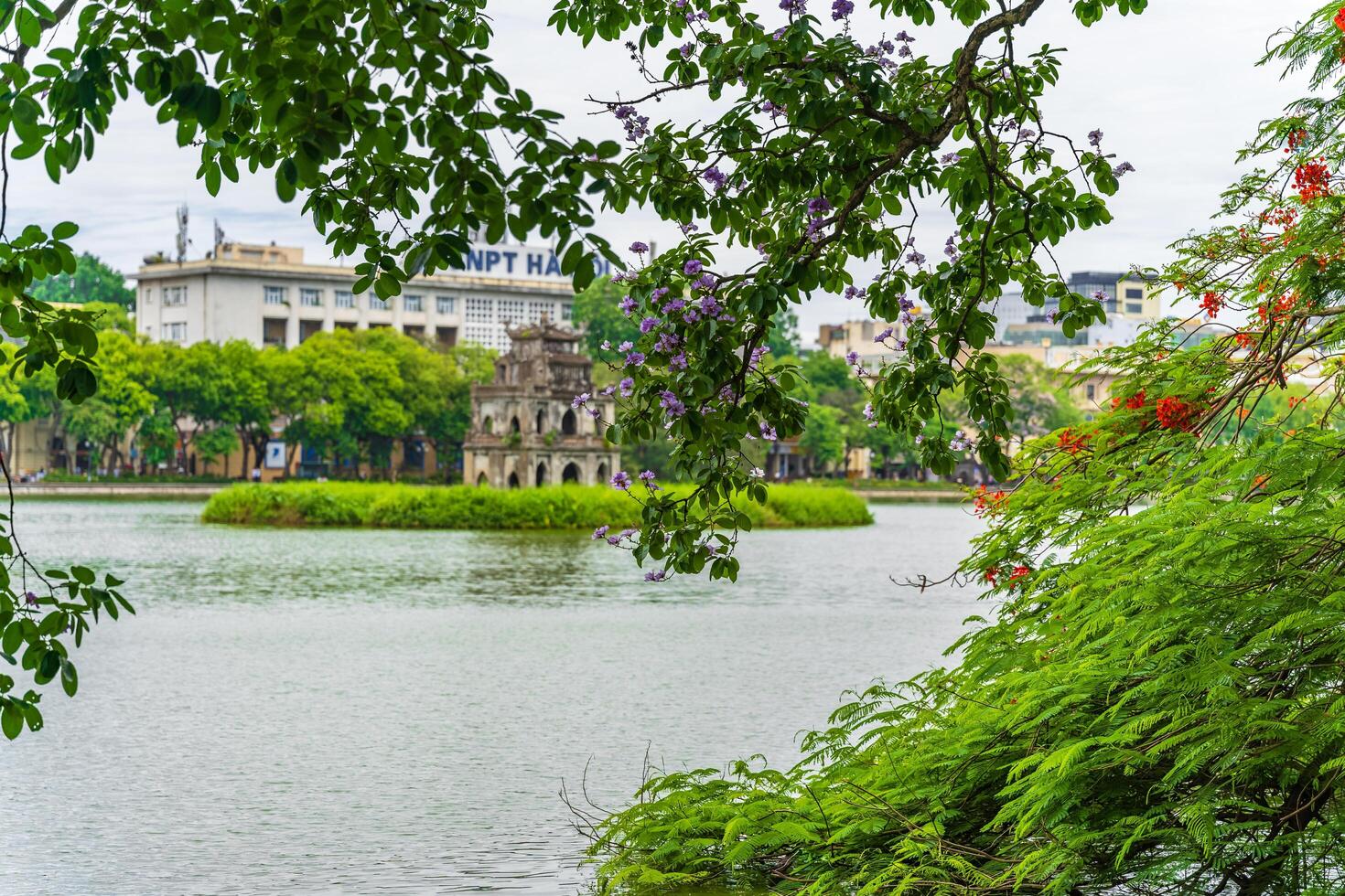 Hanoi, Vietnam - 26 June 2024 Turtle Tower Thap Rua in Hoan Kiem lake Sword lake, Ho Guom in Hanoi, Vietnam. photo