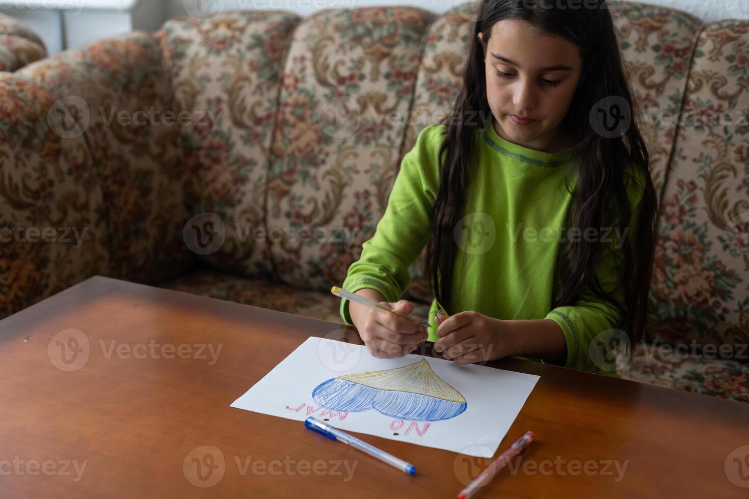 Ukrainian flag and a heart in yellow and blue color. Child draws a heart on the blackboard photo