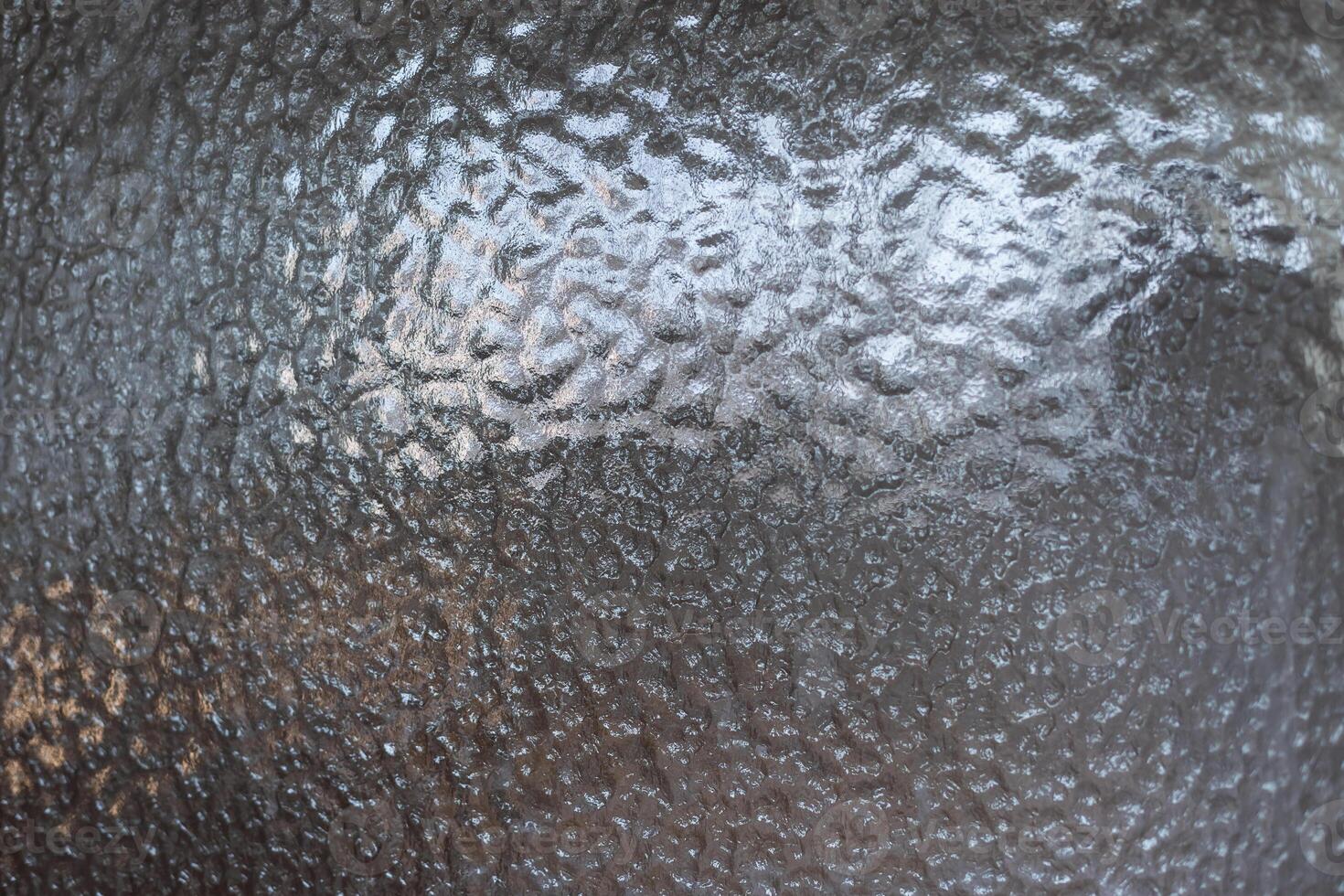 Filtering sunlight outside with opaque frosted glass photo
