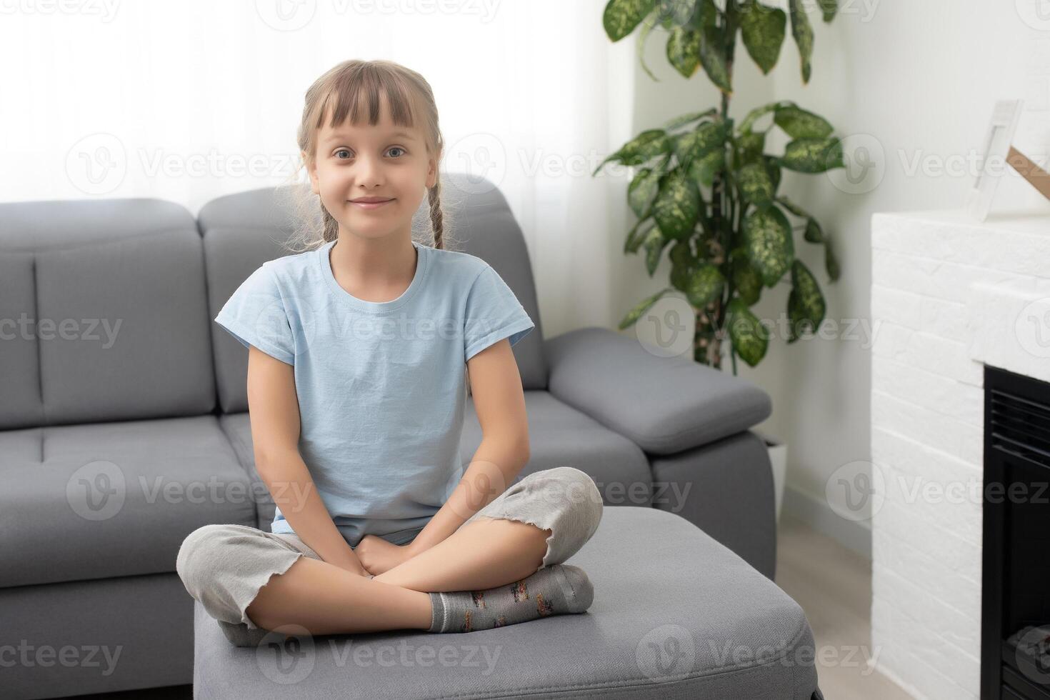 Close up headshot portrait of smiling little 8s Caucasian girl child look at camera talk on call online. Profile screen view of happy kid have webcam digital conference. Virtual event concept. photo