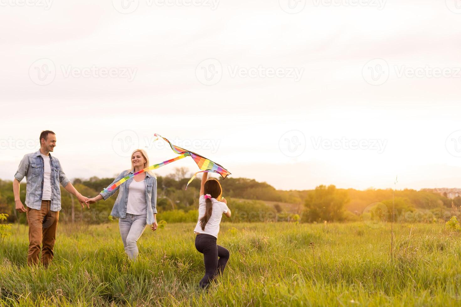 Happy family. mother, father, child daughter on nature on sunset. photo