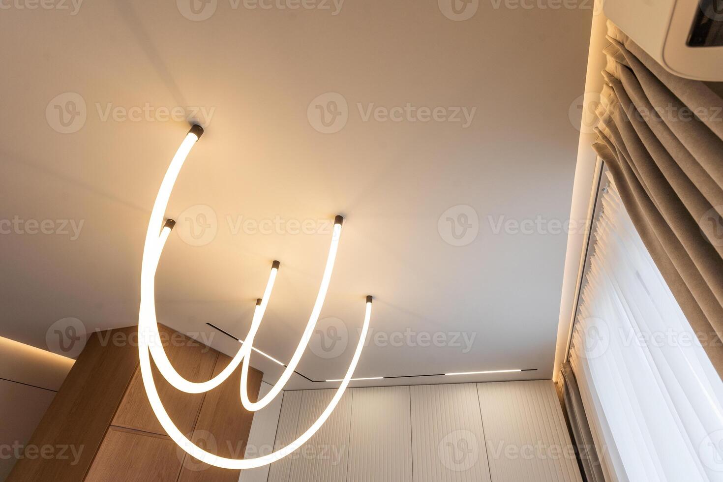 Fragment of a stretch ceiling with the hidden LED illumination photo