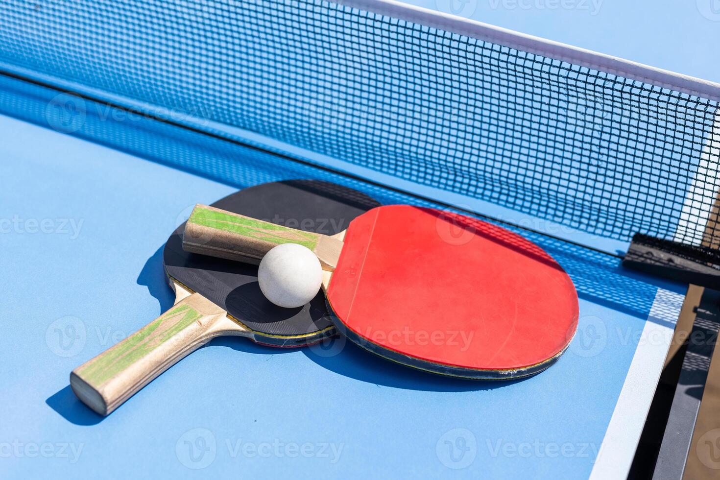 table tennis ball and paddle photo