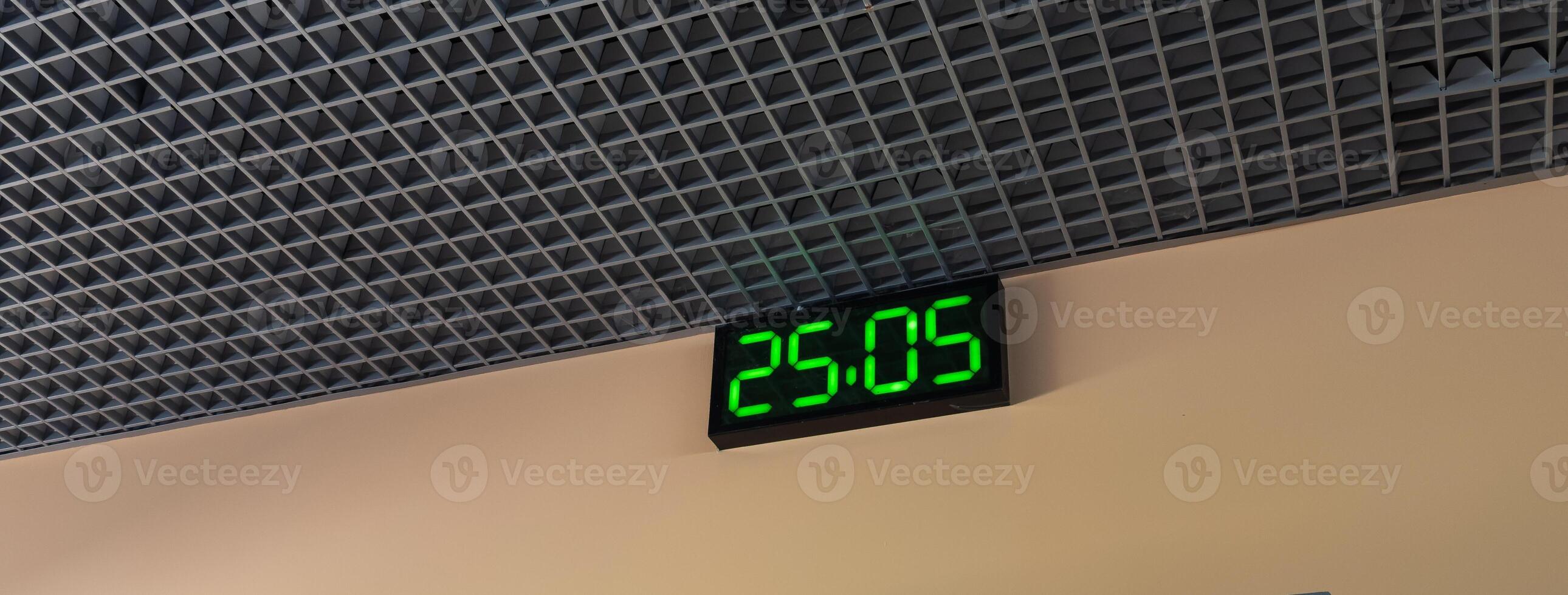 Digital clock in airport terminal. photo