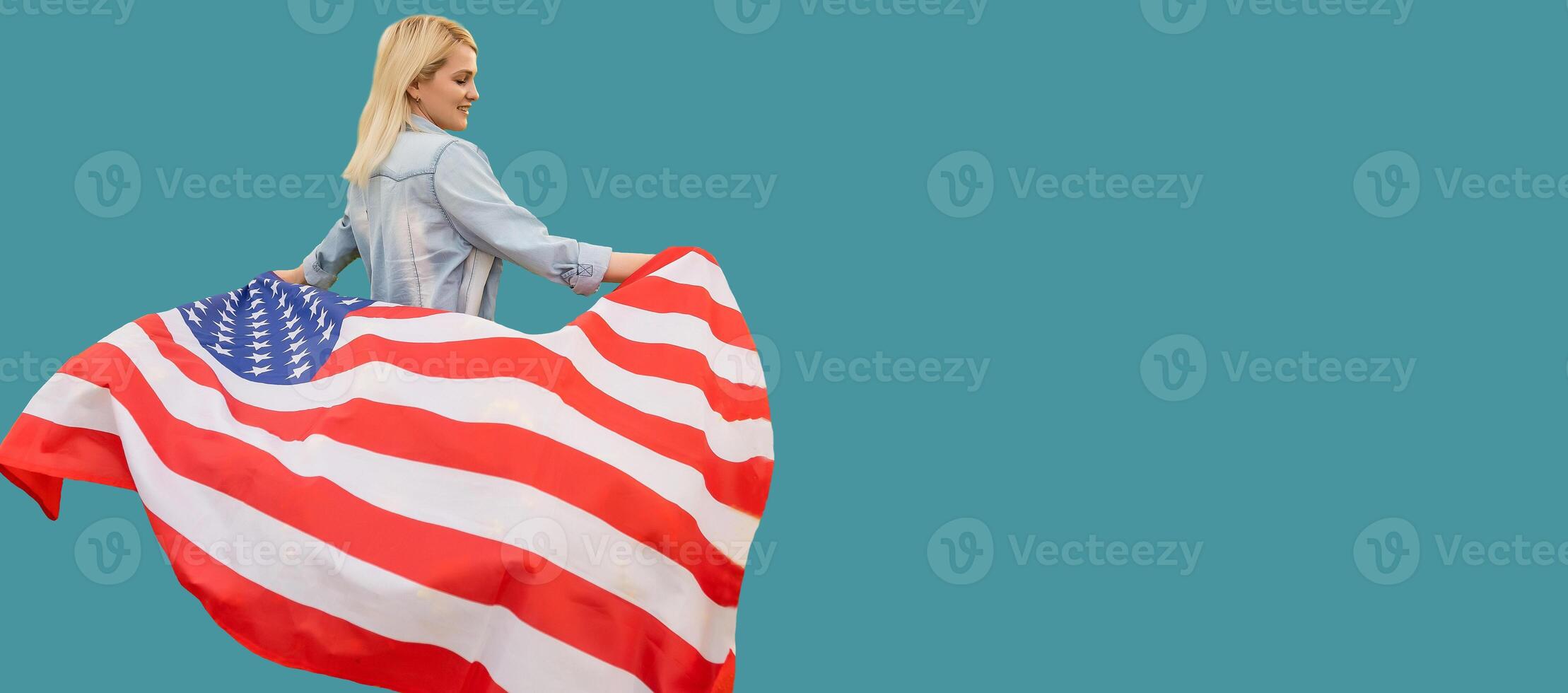 Young cute woman holding an united states flag photo