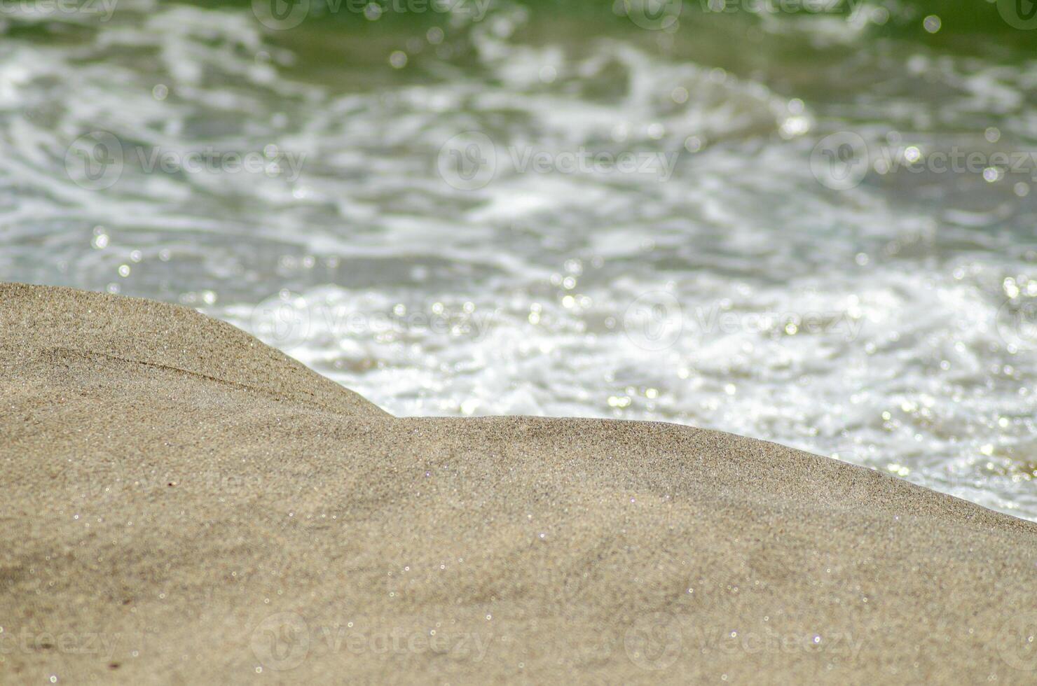 selective focus, close-up view of the shore of a beach photo