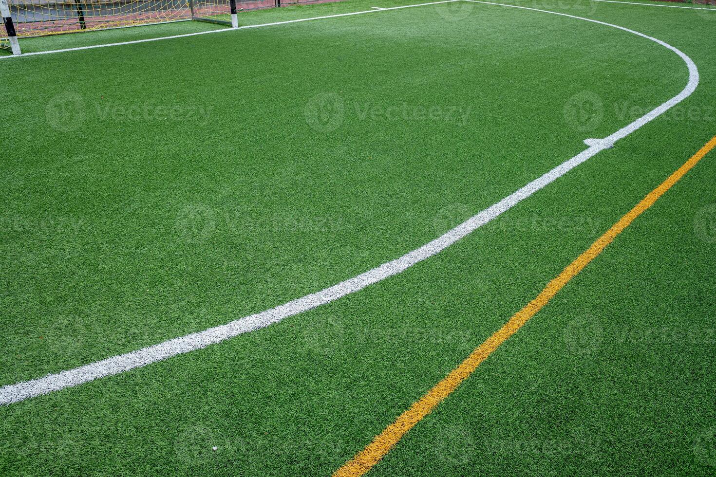 detail of the surface of an artificial grass football field. photo