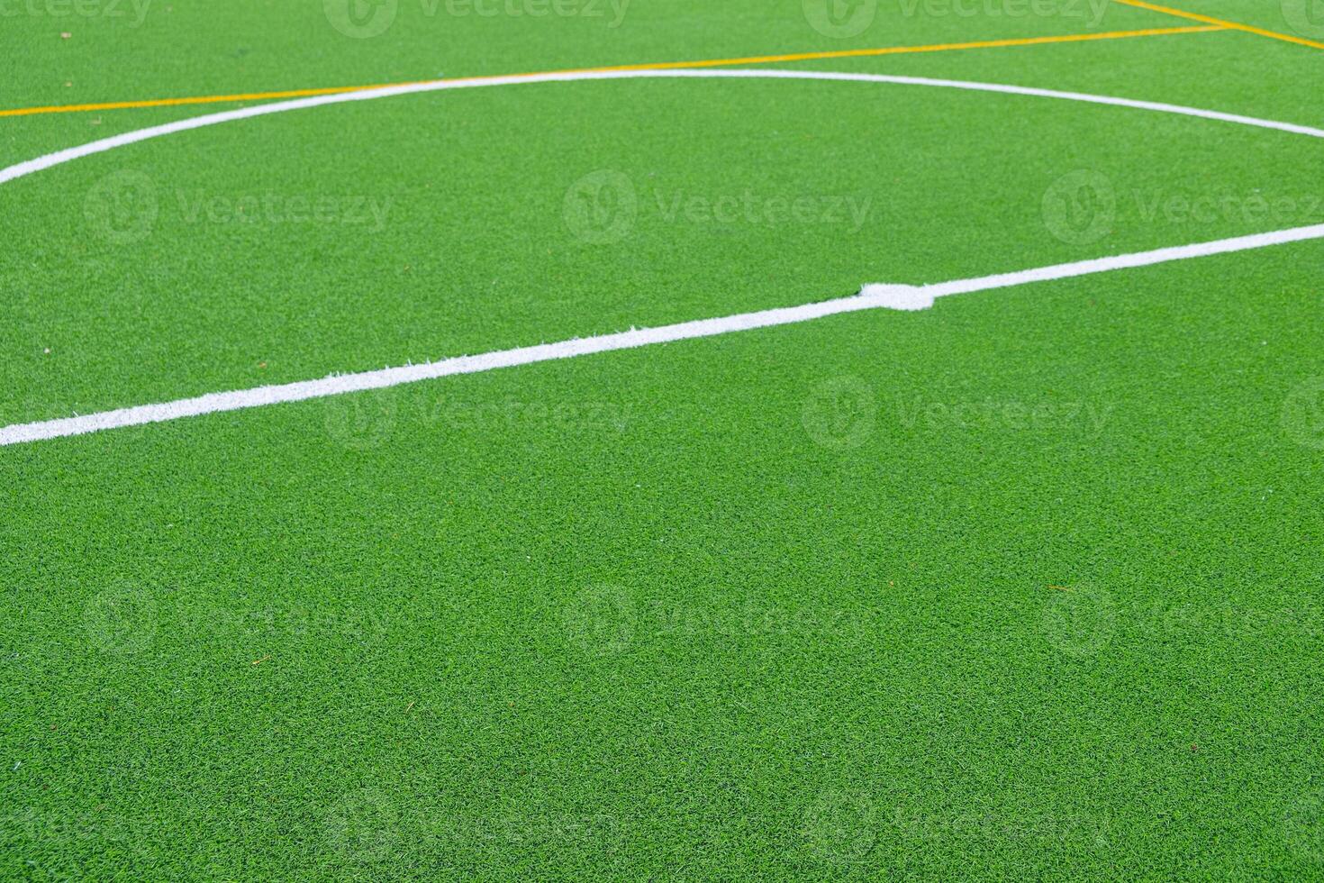 partial view of the center circle of an artificial turf football field photo